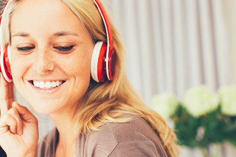 //www.mackenzieflohr.com/wp-content/uploads/2022/09/canva-close-up-of-smiling-young-woman-in-headphones-1.jpg